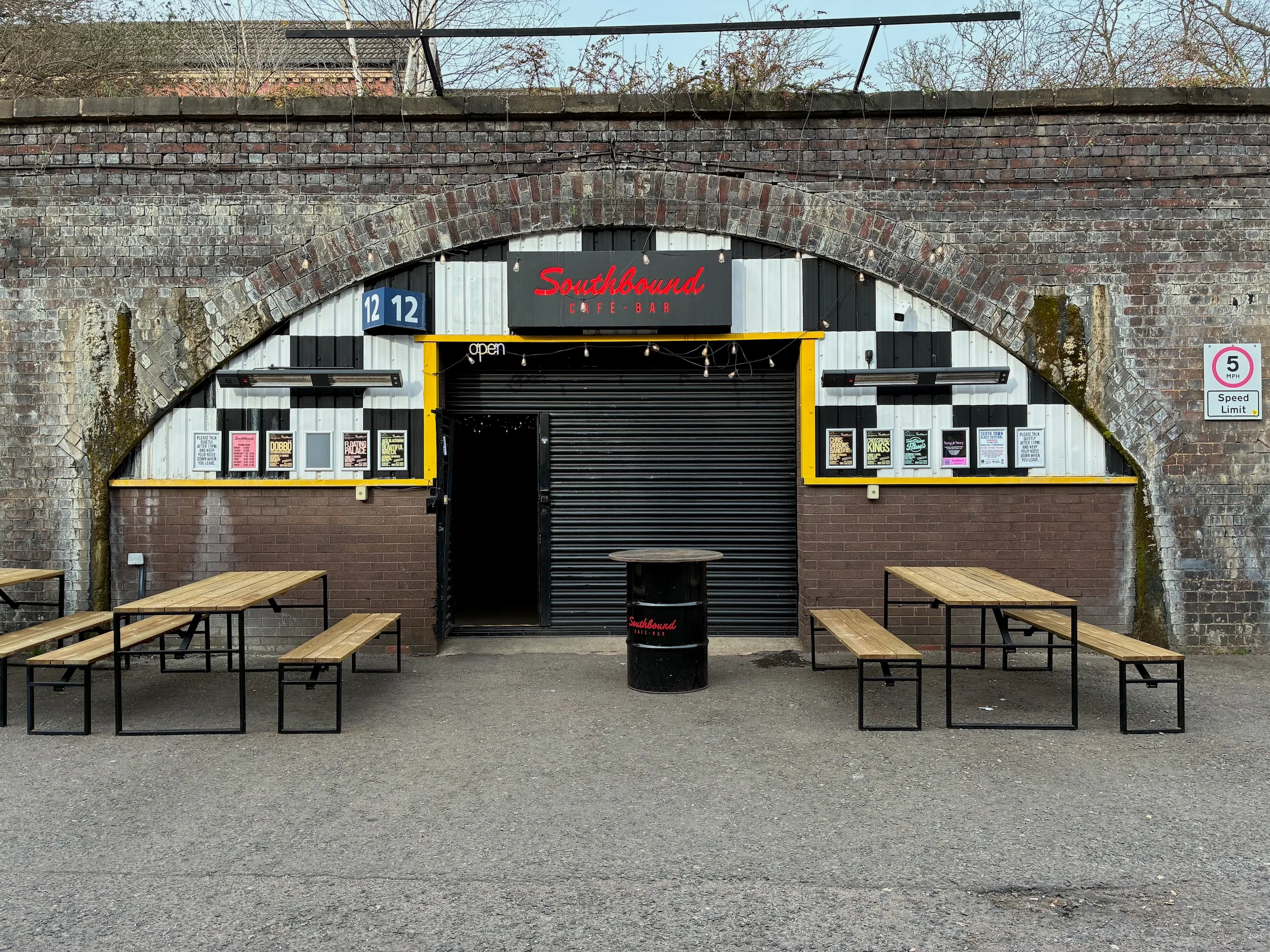 The outside of Southbound Café-Bar, a railway arch in a brick viaduct.